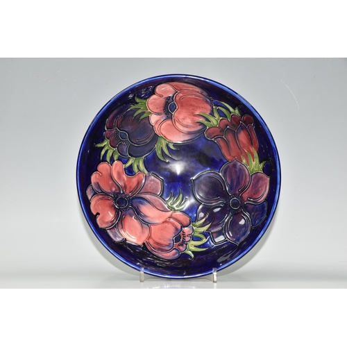 419 - A MOORCROFT POTTERY 'ANEMONE' PATTERN FRUIT BOWL, tube lined with pink and purple anemone flowers on... 