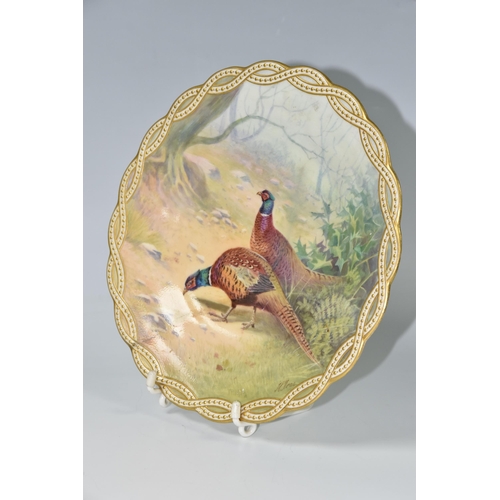 421 - A MINTON CABINET PLATE PAINTED BY J E DEAN, with gilt gadrooned border surrounding a painting of two... 