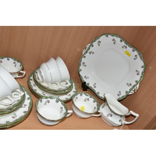 422 - A FORTY PIECE AYNSLEY A2785 TEA SET, decorated with a green border and floral sprays, comprising two... 