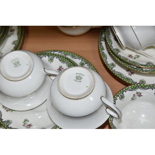 422 - A FORTY PIECE AYNSLEY A2785 TEA SET, decorated with a green border and floral sprays, comprising two... 