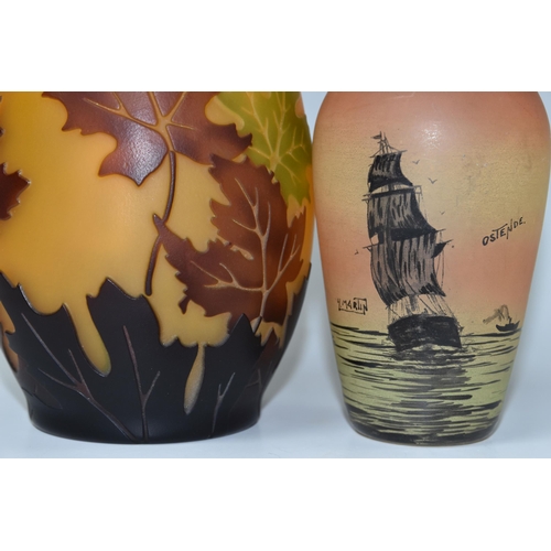 425 - TWO ART GLASS VASES, comprising a clear glass vase painted with a sailing ship at sea, signed H. Mar... 