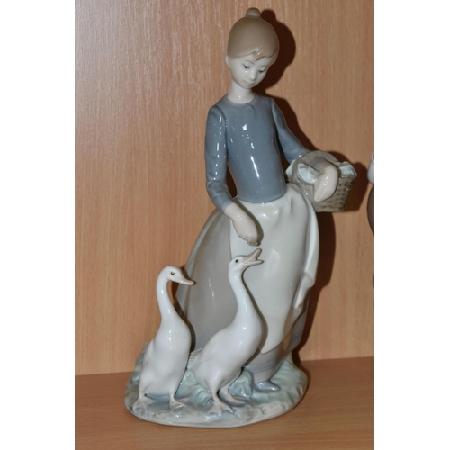 436 - A COLLECTION OF LLADRO AND NAO FIGURES, comprising Lladro: A Clean Sweep, model no 5025, sculptor Ju... 