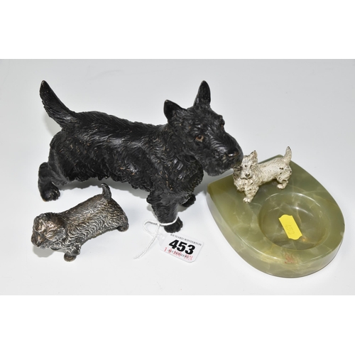 453 - THREE CAST FIGURES OF SCOTTISH AND HIGHLAND TERRIERS, comprising a green onyx ashtray/trinket dish w... 