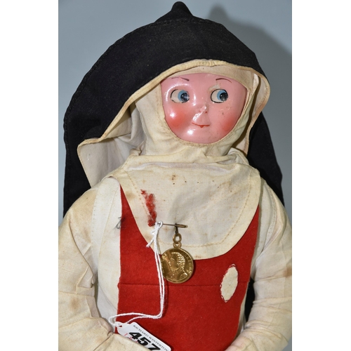 457 - A VINTAGE NURSE DOLL, painted celluloid face which has some paint loss, crush damage to nose and wea... 