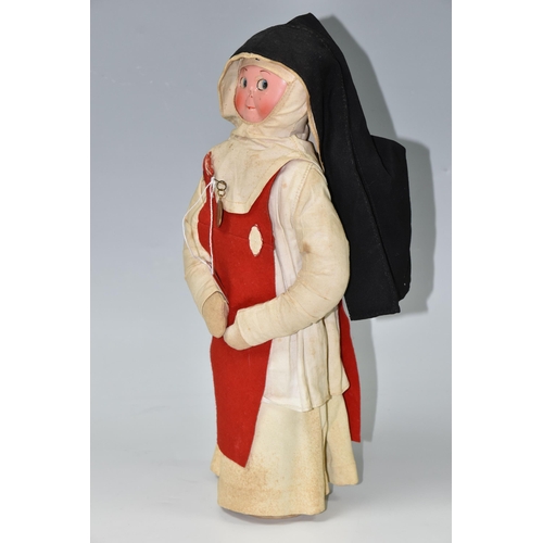 457 - A VINTAGE NURSE DOLL, painted celluloid face which has some paint loss, crush damage to nose and wea... 