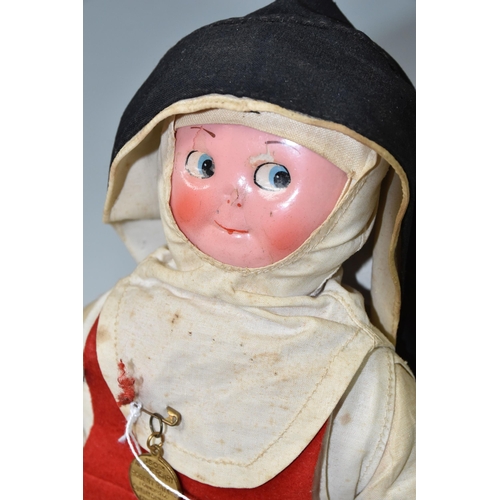 457 - A VINTAGE NURSE DOLL, painted celluloid face which has some paint loss, crush damage to nose and wea... 