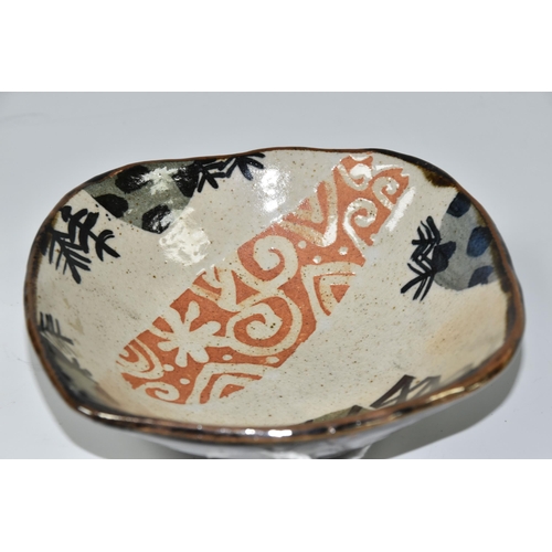 470 - JOHN MALTBY (BRITISH 1936-2020) A SHAPED SQUARE STONEWARE BOWL, decorated with stylised trees, field... 