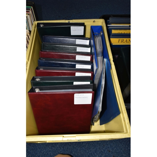 473 - FOUR BOXES OF TELEPHONE CARDS, a collection of UK and international telephone cards in folders, coun... 