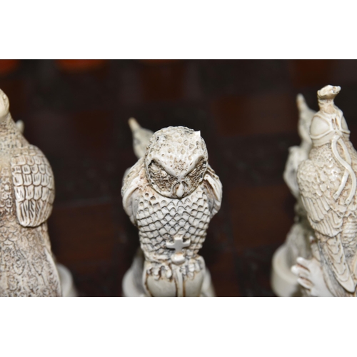 476 - A BIRD THEMED RESIN CHESS SET, all the pieces formed as birds, several with minor damage and old rep... 