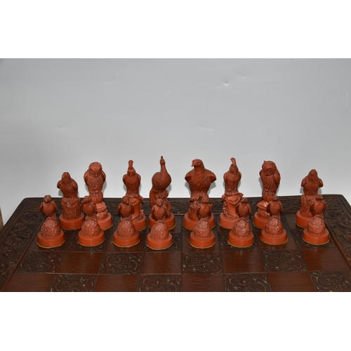 476 - A BIRD THEMED RESIN CHESS SET, all the pieces formed as birds, several with minor damage and old rep... 