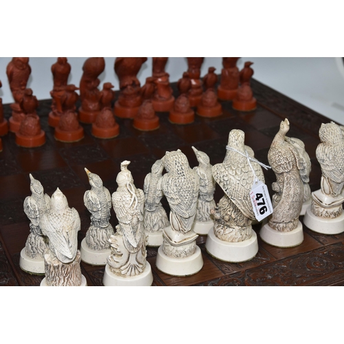 476 - A BIRD THEMED RESIN CHESS SET, all the pieces formed as birds, several with minor damage and old rep... 