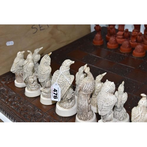 476 - A BIRD THEMED RESIN CHESS SET, all the pieces formed as birds, several with minor damage and old rep... 