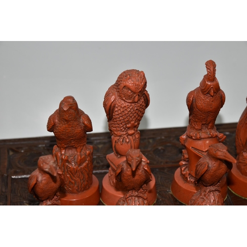 476 - A BIRD THEMED RESIN CHESS SET, all the pieces formed as birds, several with minor damage and old rep... 