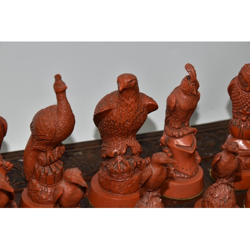 476 - A BIRD THEMED RESIN CHESS SET, all the pieces formed as birds, several with minor damage and old rep... 