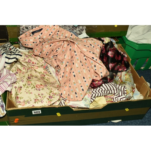 523 - SEVEN BOXES OF LADIES' CLOTHES, included ladies' t shirts, blouses, and skirts, sizes vary from smal... 