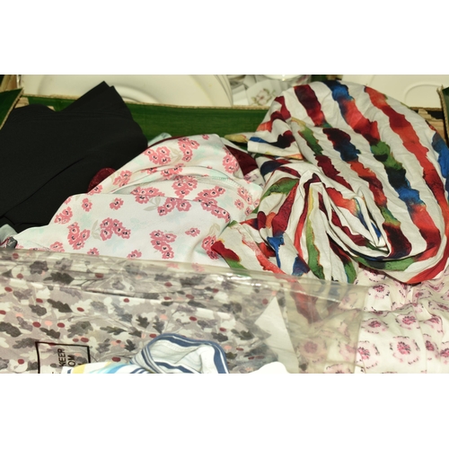 523 - SEVEN BOXES OF LADIES' CLOTHES, included ladies' t shirts, blouses, and skirts, sizes vary from smal... 