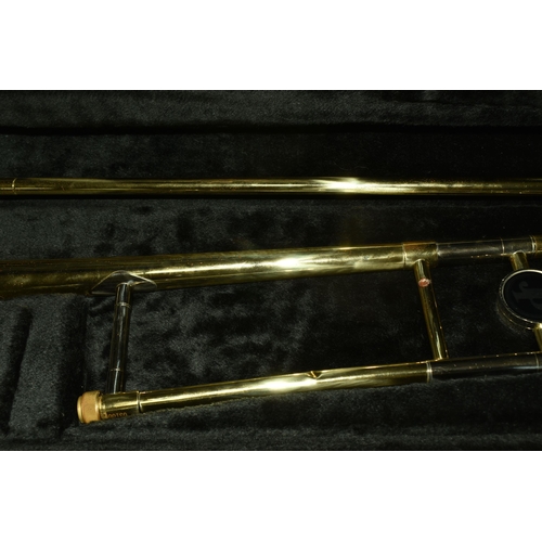 535 - A CASED BRASS JOHN PACKER TROMBONE, stamped JP 031, in a contemporary fitted John Packer travelling ... 