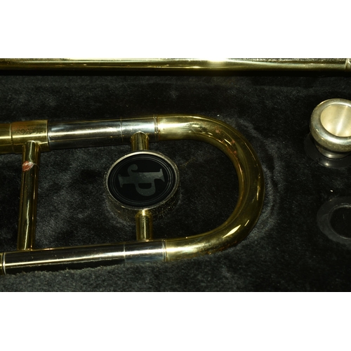 535 - A CASED BRASS JOHN PACKER TROMBONE, stamped JP 031, in a contemporary fitted John Packer travelling ... 