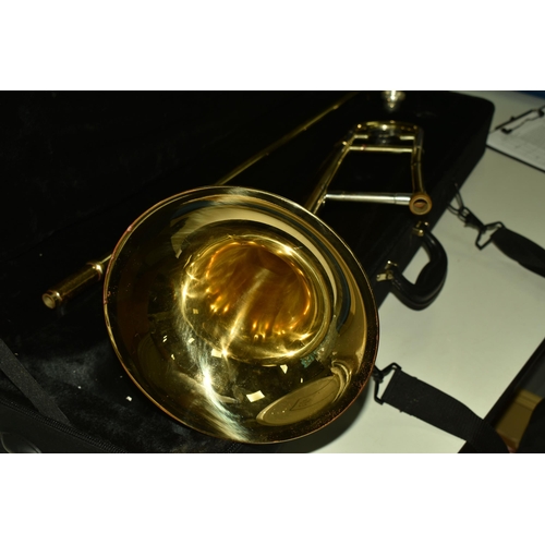 535 - A CASED BRASS JOHN PACKER TROMBONE, stamped JP 031, in a contemporary fitted John Packer travelling ... 