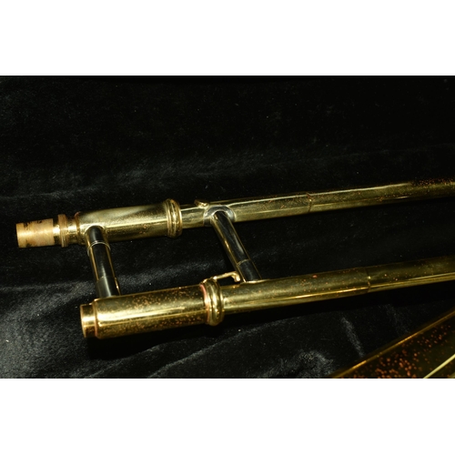 535 - A CASED BRASS JOHN PACKER TROMBONE, stamped JP 031, in a contemporary fitted John Packer travelling ... 