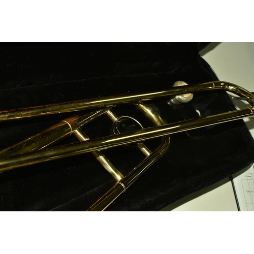 535 - A CASED BRASS JOHN PACKER TROMBONE, stamped JP 031, in a contemporary fitted John Packer travelling ... 