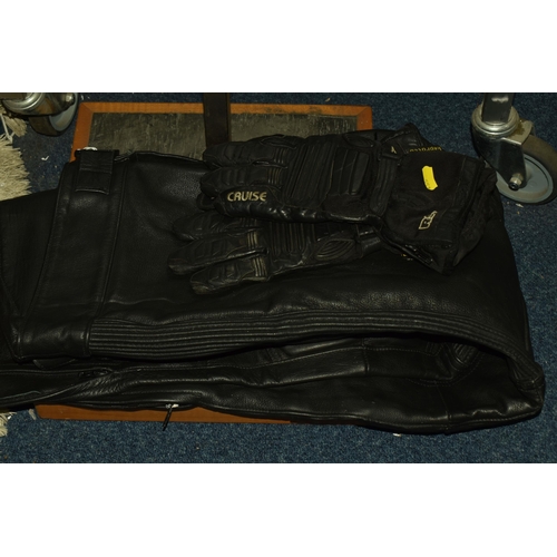 553 - A SET OF MEN'S MOTORBIKE LEATHERS, comprising a pair of 'TT Leathers' black leather trousers, UK siz... 