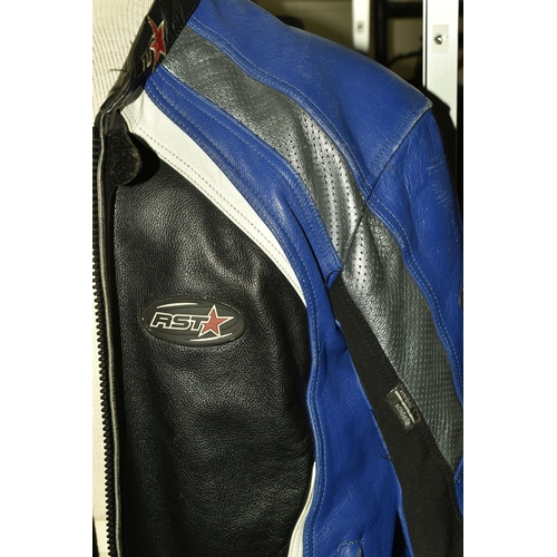 553 - A SET OF MEN'S MOTORBIKE LEATHERS, comprising a pair of 'TT Leathers' black leather trousers, UK siz... 