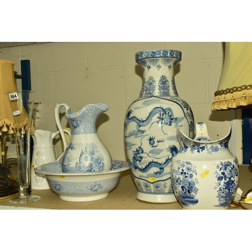 554 - A COLLECTION OF CERAMICS AND TABLE LAMPS, comprising a large blue and white Oriental vase decorated ... 