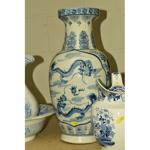 554 - A COLLECTION OF CERAMICS AND TABLE LAMPS, comprising a large blue and white Oriental vase decorated ... 