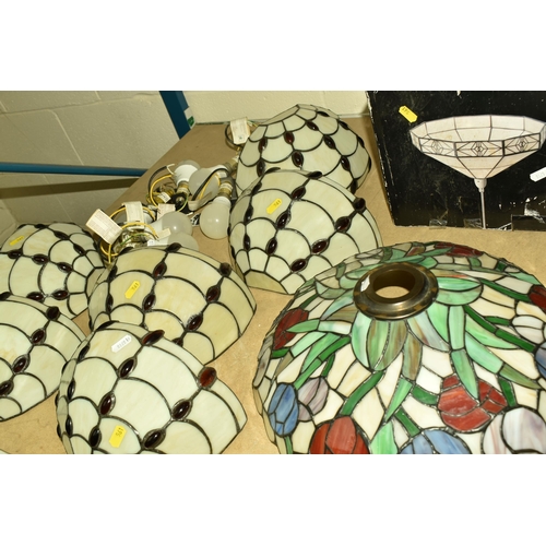 561 - A COLLECTION OF GLASS TIFFANY STYLE LIGHT SHADES AND THREE CLOCKS, comprising a set of seven glass T... 