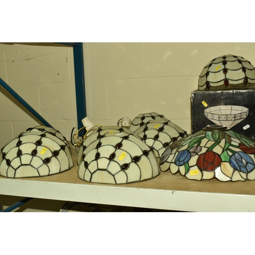 561 - A COLLECTION OF GLASS TIFFANY STYLE LIGHT SHADES AND THREE CLOCKS, comprising a set of seven glass T... 