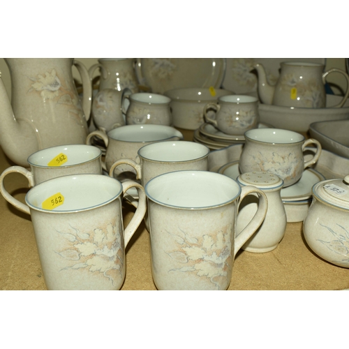 562 - A QUANTITY OF DENBY 'TASMIN' PATTERN DINNERWARE, comprising a coffee pot, teapot (missing lid), four... 