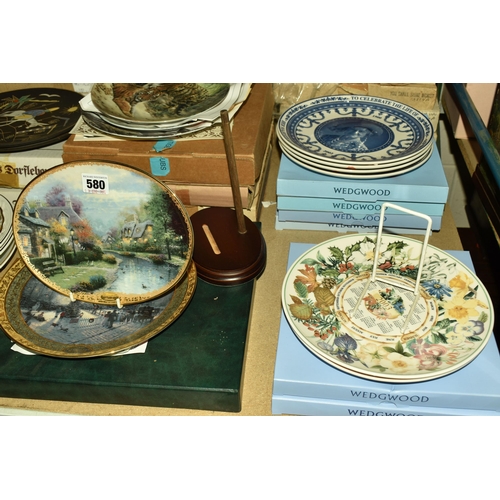 580 - A LARGE QUANTITY OF BOXED COLLECTOR'S PLATES, comprising two boxed Wedgwood Daily Mail calendar plat... 