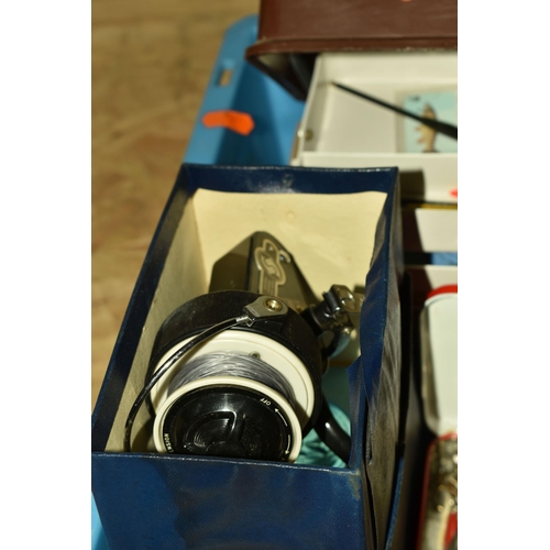 584 - A BOX AND LOOSE FISHING EQUIPMENT, to include an unmarked fishing rod, and three unmarked rods with ... 