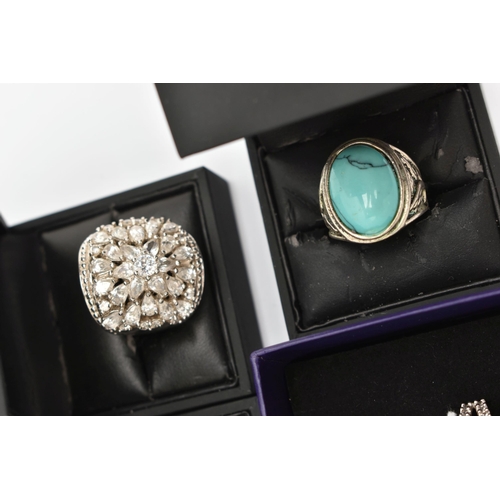 SIX BOXED WHITE METAL RINGS, various designs each set with stones to ...
