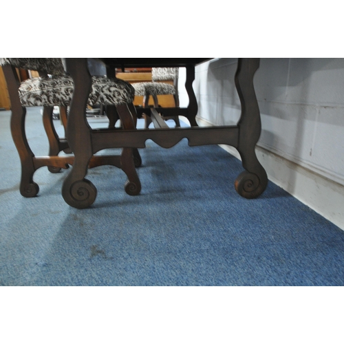 1201 - A YOUNGER TOLEDO EXTENDING DINING TABLE, with a single fold out leaf, raised on shaped legs, united ... 