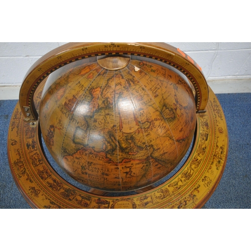 1202 - A 20TH CENTURY DRINKS GLOBE, the hinged lid enclosing a fitted interior, raised on turned supports, ... 