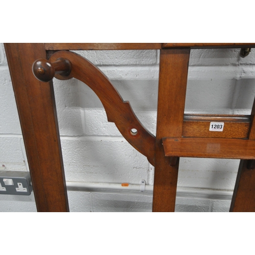 1203 - A 20TH CENTURY MAHOGANY HALL STAND, with a central bevelled edge mirror, seven pegs, three hooks, a ... 