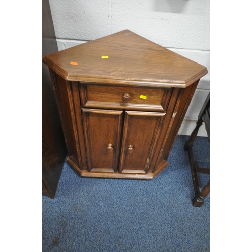 1204 - A 20TH CENTURY OAK BUREAU, the fall front door enclosing a fitted interior, above four drawers, widt... 