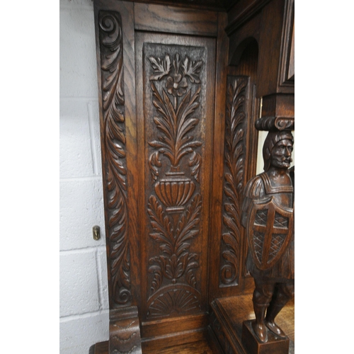 1208 - A 20TH CENTURY OAK MIRROR BACK SIDEBOARD, with a foliate crest and carved details, the central bevel... 