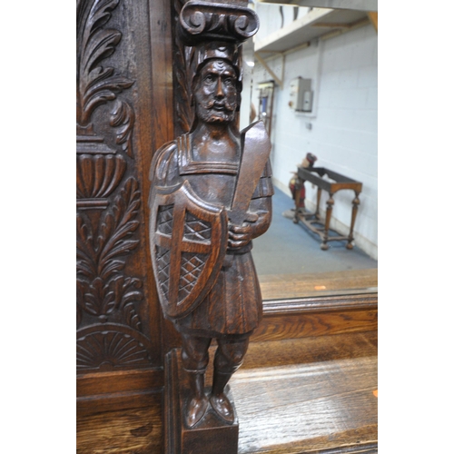 1208 - A 20TH CENTURY OAK MIRROR BACK SIDEBOARD, with a foliate crest and carved details, the central bevel... 