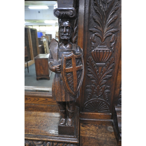 1208 - A 20TH CENTURY OAK MIRROR BACK SIDEBOARD, with a foliate crest and carved details, the central bevel... 