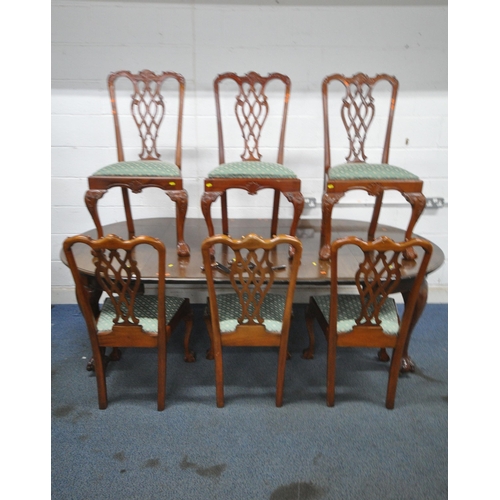 1216 - A VICTORIAN MAHOGANY WIND OUT DINING TABLE, with three additional leaves, raised on cabriole legs, w... 