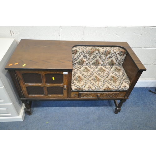 1231 - A 20TH CENTURY OAK TELEPHONE TABLE, fitted with a single drawer and cupboard doors, raised on turned... 