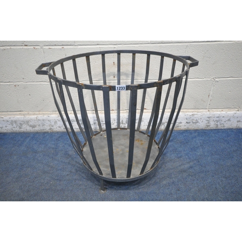 1233 - A CYLINDRICAL AND TAPERED STEEL LOG BASKET, with twin handles, width to handles 70cm x diameter 61cm... 