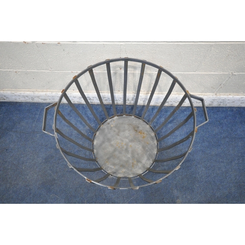 1233 - A CYLINDRICAL AND TAPERED STEEL LOG BASKET, with twin handles, width to handles 70cm x diameter 61cm... 