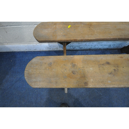 1235 - A PAIR OF PINE BENCHES, raised on trestle legs, length 124cm x depth 28cm x height 48cm (condition r... 