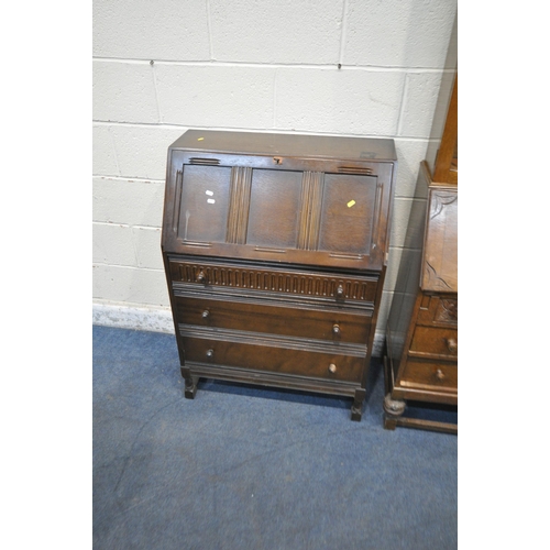 1244 - A 20TH CENTURY OAK BUREAU BOOKCASE, the double glazed door enclosing two shelves, atop a base with a... 