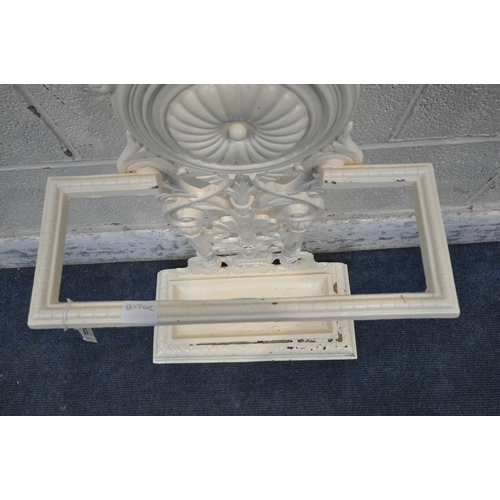 1248 - A CREAM PAINTED CAST IRON STICK STAND, with scrolled and foliate details, and a removable drip tray,... 