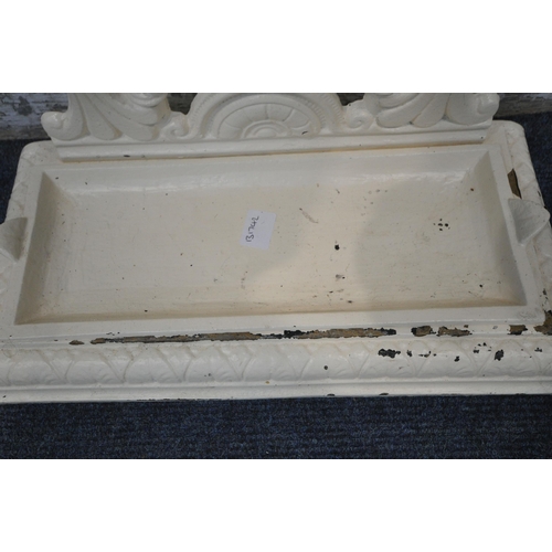 1248 - A CREAM PAINTED CAST IRON STICK STAND, with scrolled and foliate details, and a removable drip tray,... 